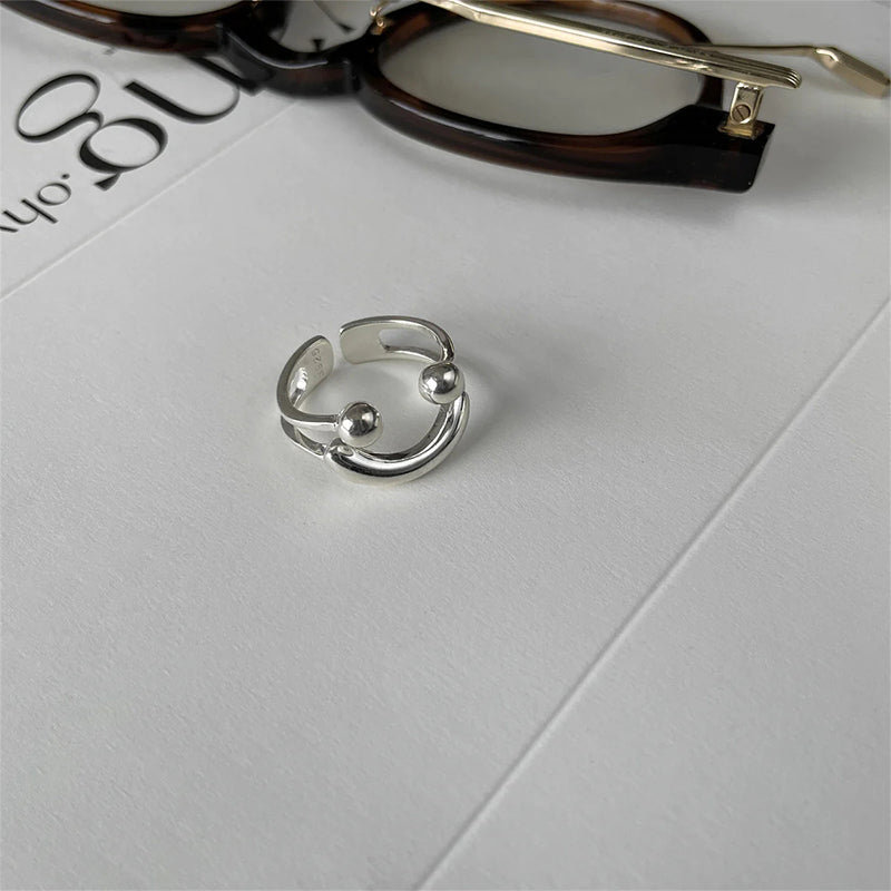 Glimlachvormige openingsring