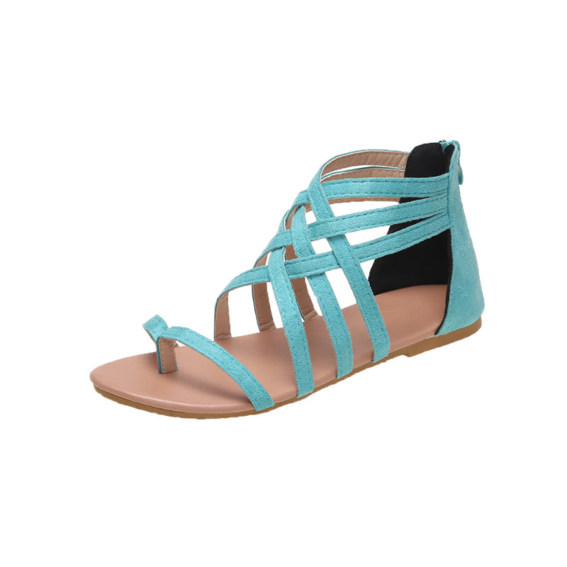 Platte zomersandalen met gekruiste bandjes en rits