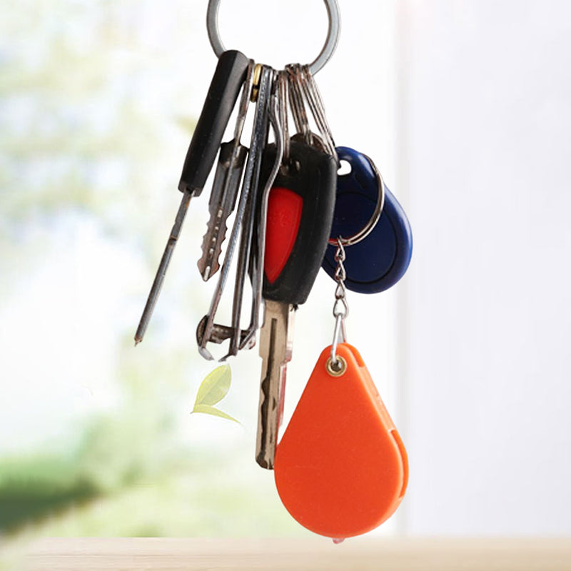 Opvouwbare sleutelhanger met vergrootglas