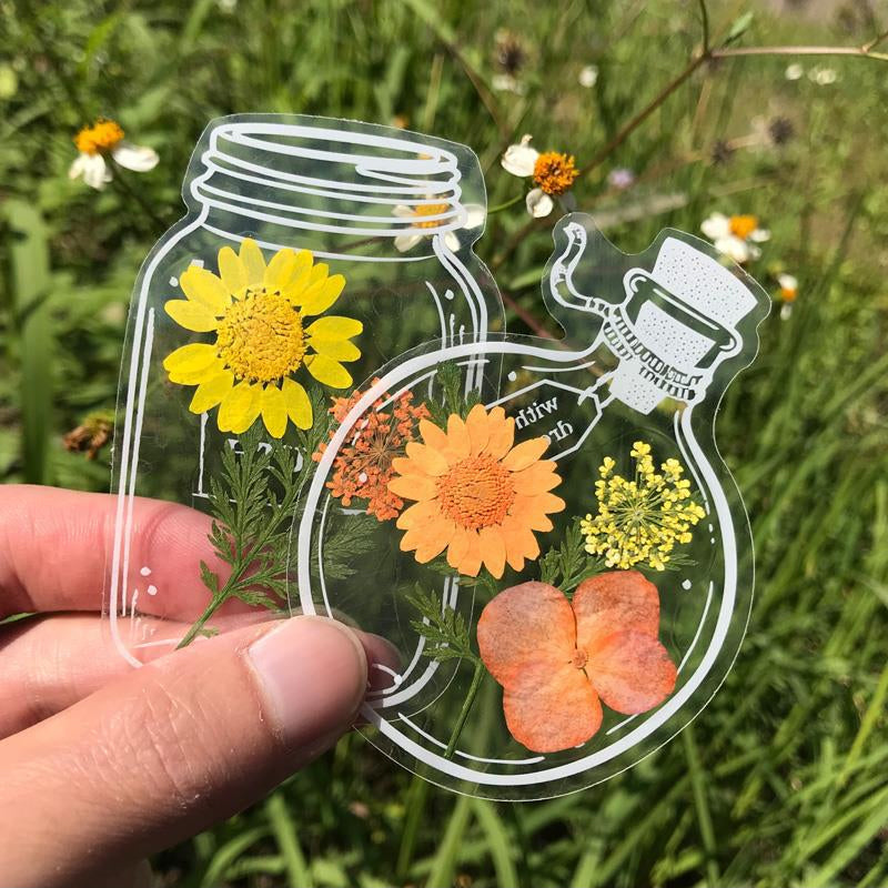Transparante bladwijzers met gedroogde bloemen