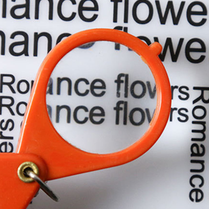 Opvouwbare sleutelhanger met vergrootglas