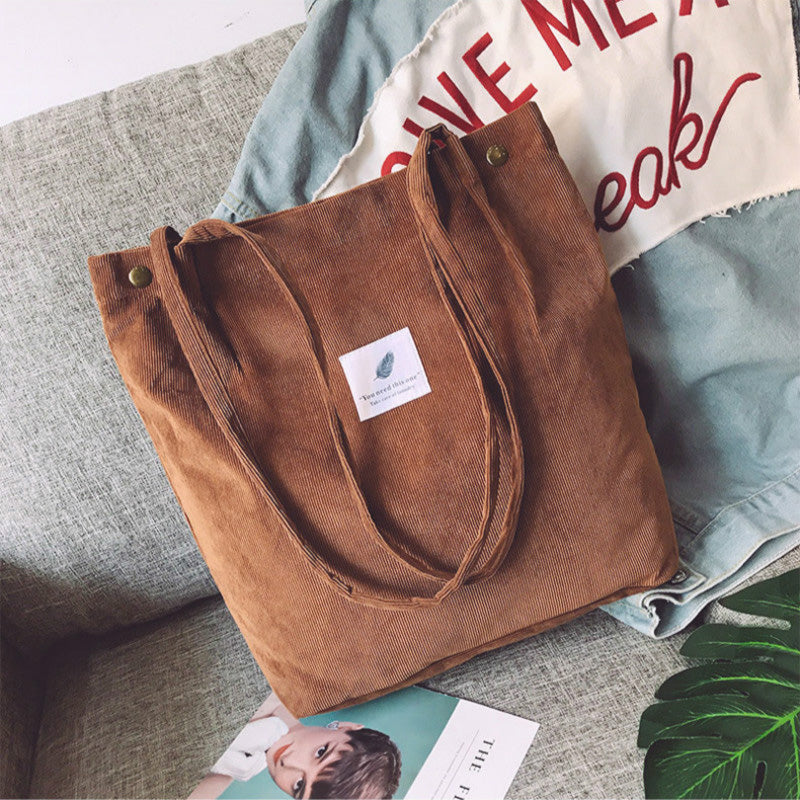 Corduroy draagtas met letterpatch