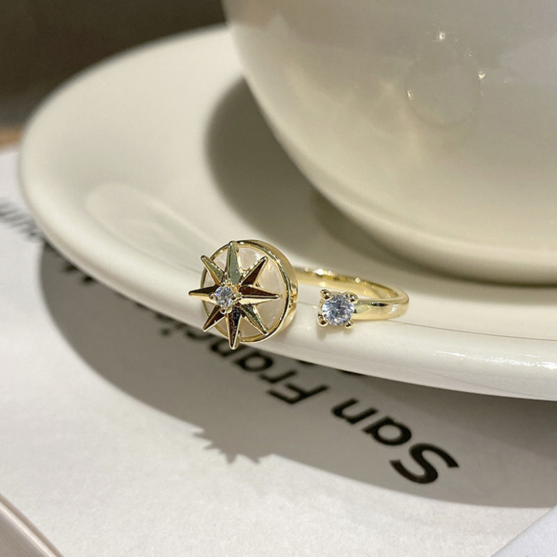 Achtpuntige ster wervelende ring